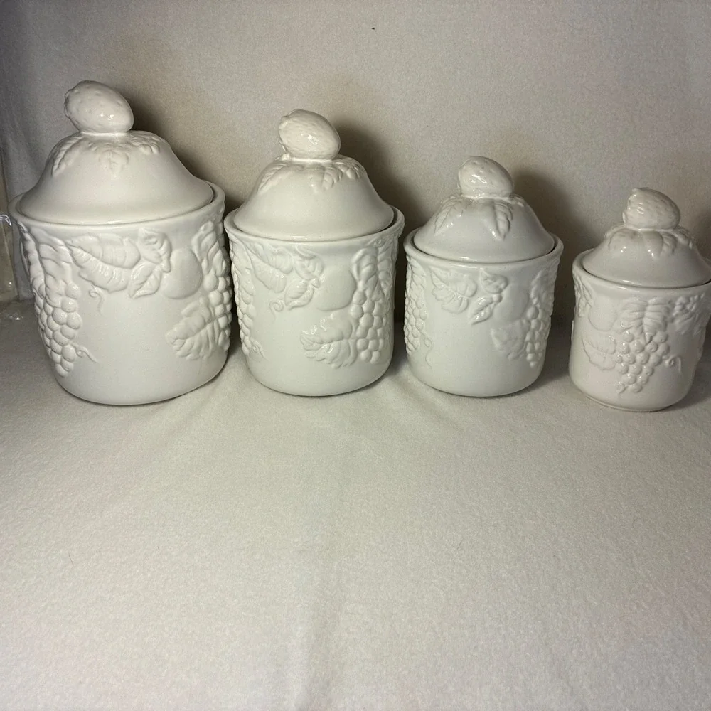 Set of  4 Vintage White Lidded Ceramic Canisters,  Grapevine and Strawberry Lid.